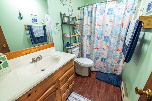 full bathroom featuring toilet, baseboard heating, vanity, wood finished floors, and a shower with curtain