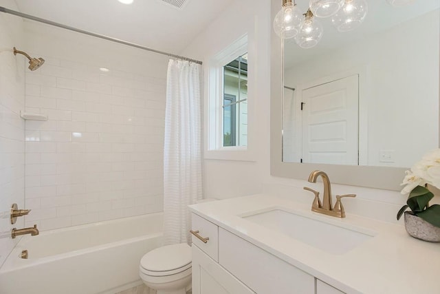 full bath featuring shower / tub combo, vanity, and toilet