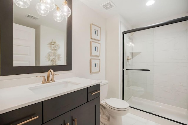 full bathroom with toilet, vanity, a shower stall, and visible vents