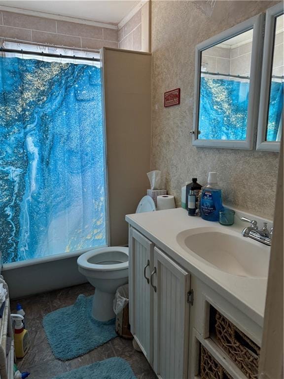 full bathroom with shower / bath combo, vanity, and toilet