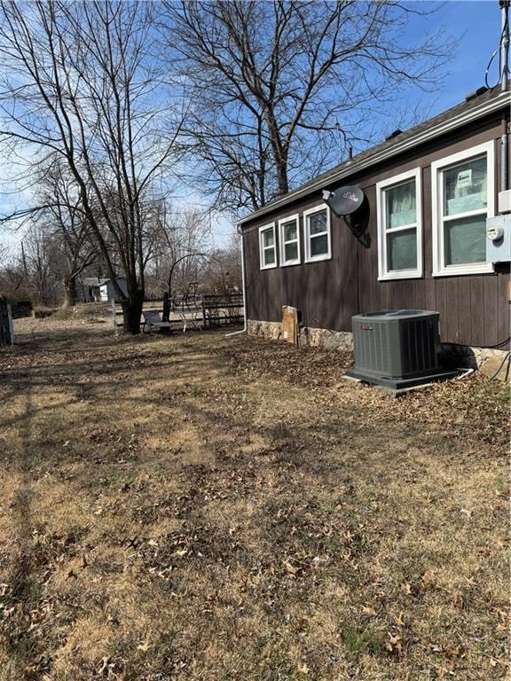 view of side of property with central AC unit