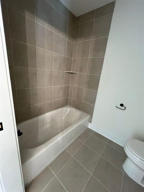 full bathroom with toilet, baseboards, and tile patterned floors