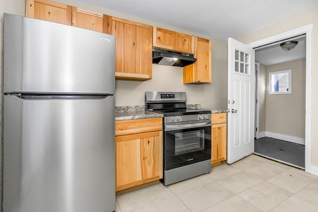 kitchen with stainless steel appliances, light countertops, under cabinet range hood, and light brown cabinetry