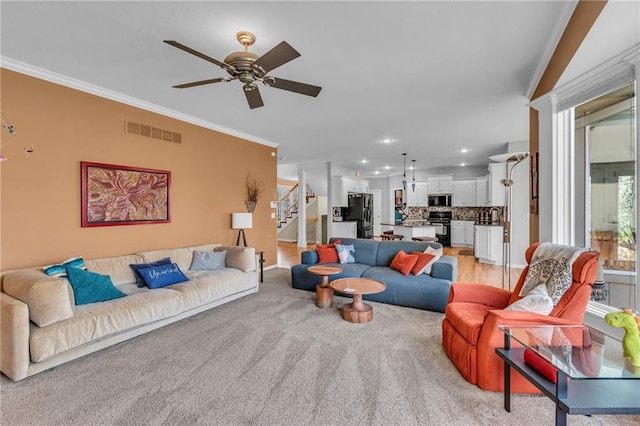 living area featuring ornamental molding, stairway, a ceiling fan, recessed lighting, and baseboards