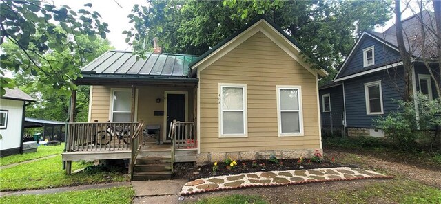 408 W Peoria St, Paola, KS 66071 - view of front of property featuring a standing seam roof and metal roof
