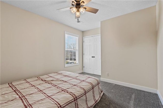 unfurnished bedroom with baseboards, carpet, visible vents, and a textured ceiling