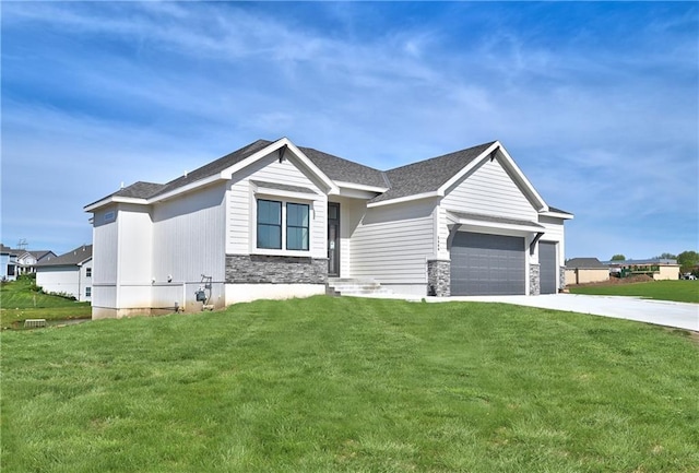 view of front facade featuring a garage, a front yard, stone siding, and driveway