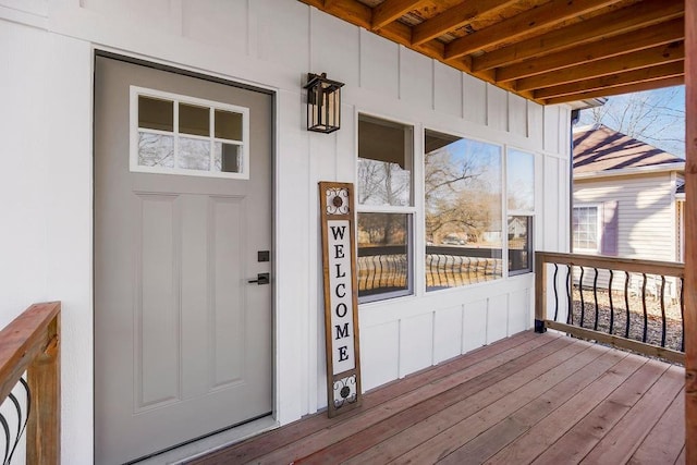 property entrance featuring board and batten siding