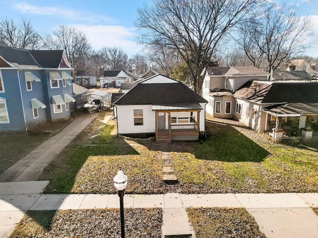 view of front of home with a residential view and a wooden deck