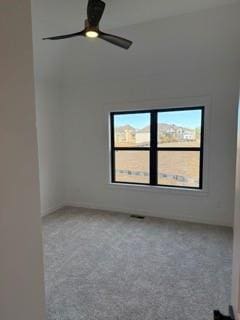 spare room featuring carpet floors and a ceiling fan