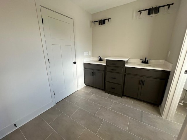 bathroom featuring tile patterned flooring and vanity