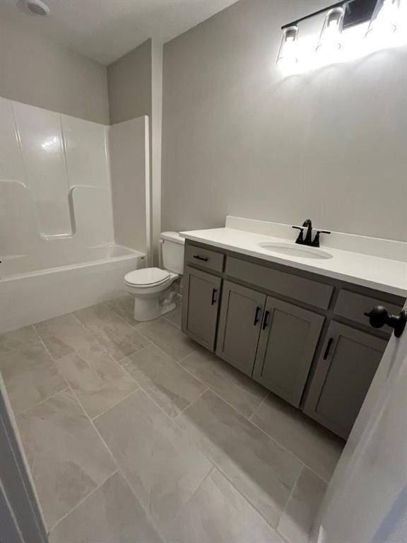 bathroom featuring toilet, shower / bath combination, and vanity