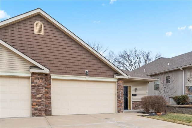 view of front of house with a garage and concrete driveway