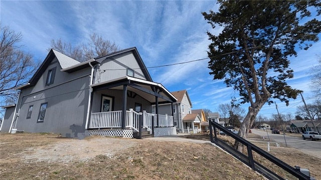 view of property exterior featuring covered porch