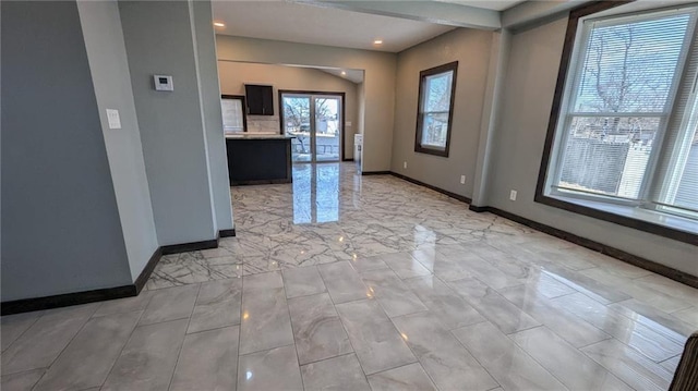 interior space featuring baseboards