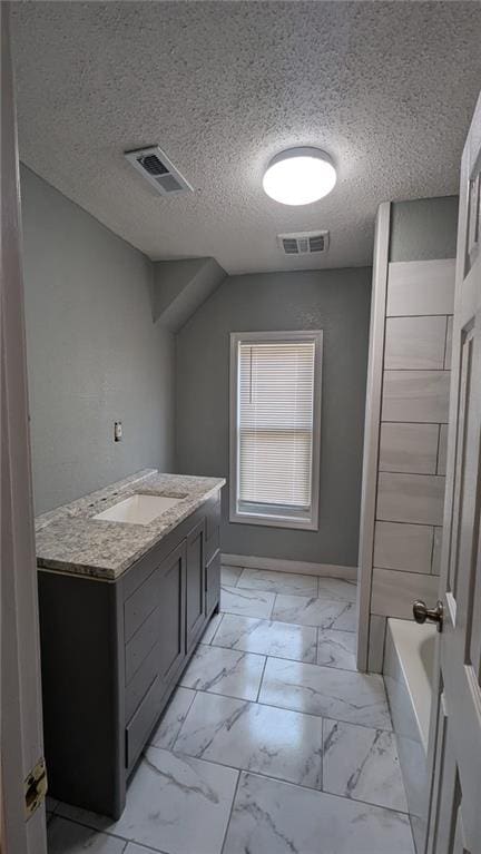 bathroom featuring marble finish floor, vanity, and visible vents