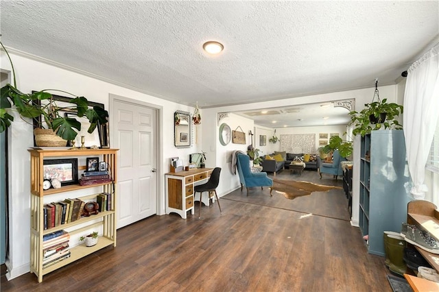 living area featuring a textured ceiling and wood finished floors