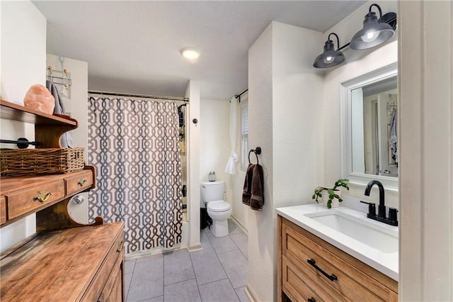 bathroom with toilet, tile patterned flooring, a shower with shower curtain, and vanity