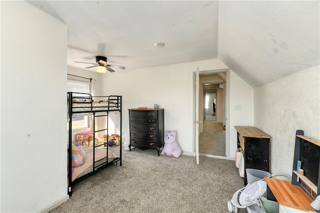 bedroom featuring carpet floors, ceiling fan, baseboards, and vaulted ceiling