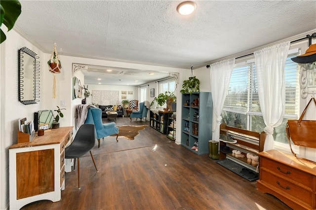 sitting room with a textured ceiling and wood finished floors