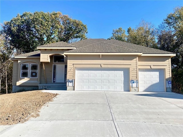 view of front of property featuring driveway and an attached garage