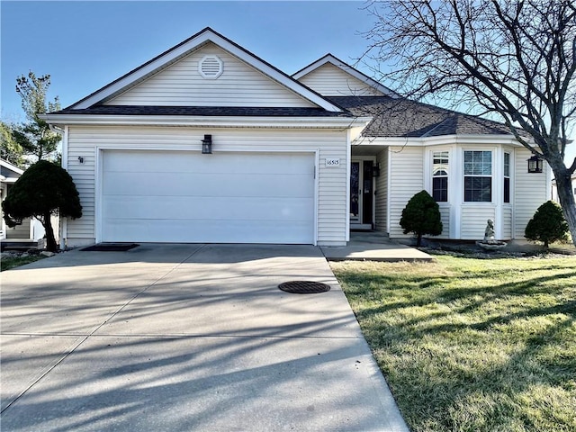 single story home with a garage, roof with shingles, concrete driveway, and a front lawn