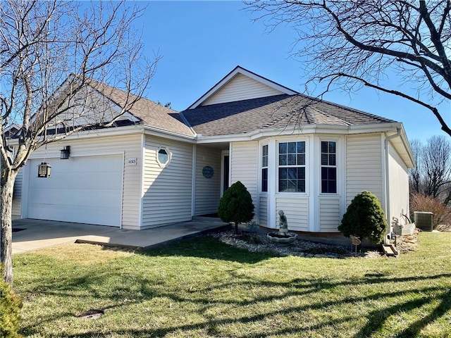 single story home with driveway, a front lawn, central AC, roof with shingles, and an attached garage