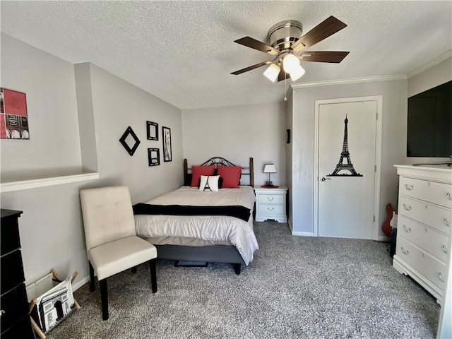 bedroom with a textured ceiling, ceiling fan, and carpet flooring