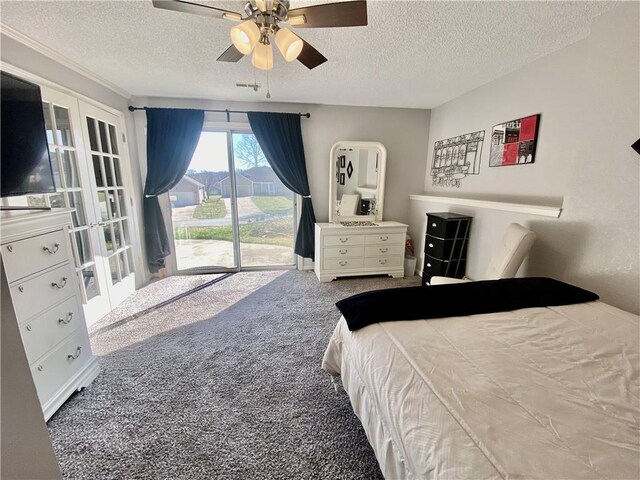 carpeted bedroom featuring access to outside, a ceiling fan, and a textured ceiling