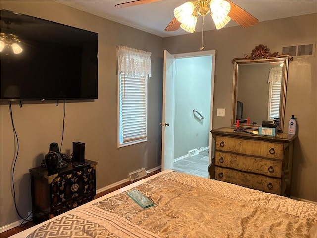 bedroom featuring baseboards, visible vents, and ceiling fan