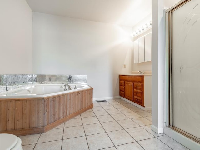 full bath featuring a garden tub, toilet, tile patterned flooring, and vanity