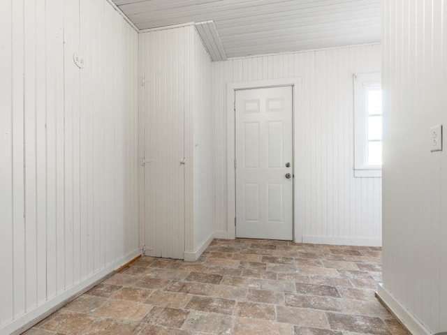 spare room with brick floor