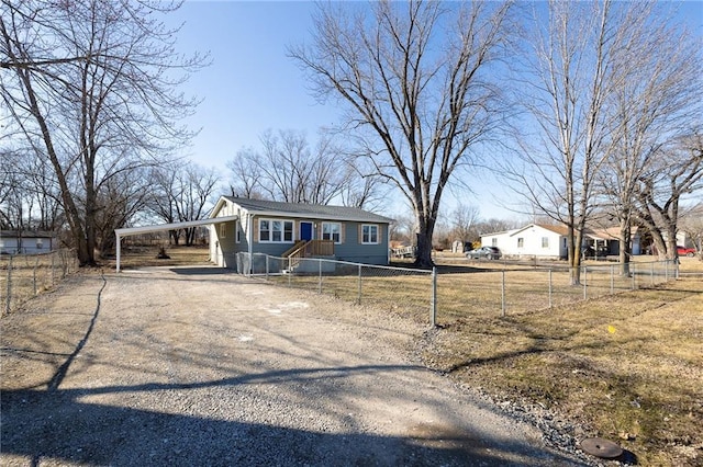 view of front of home with driveway and a fenced front yard