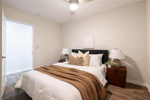 bedroom with ceiling fan, baseboards, and wood finished floors