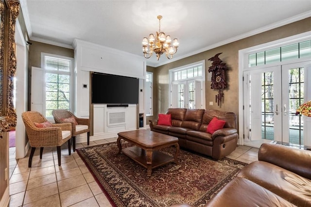 living room with ornamental molding, french doors, light tile patterned flooring, and a chandelier