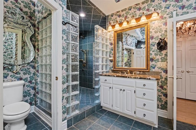 full bath with tile patterned flooring, walk in shower, toilet, and wallpapered walls