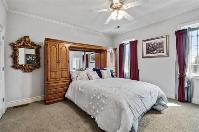 bedroom with baseboards, ornamental molding, visible vents, and light colored carpet