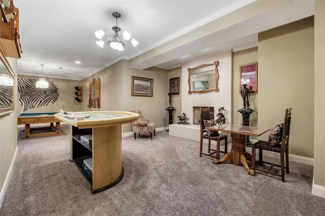 rec room featuring baseboards, a fireplace, ornamental molding, and carpet flooring