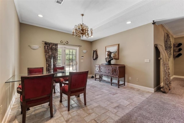 dining area with an inviting chandelier, visible vents, baseboards, and crown molding