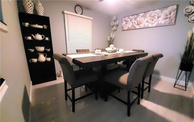 dining room featuring baseboards