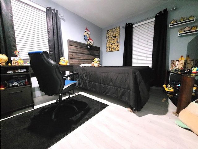 bedroom with wood finished floors