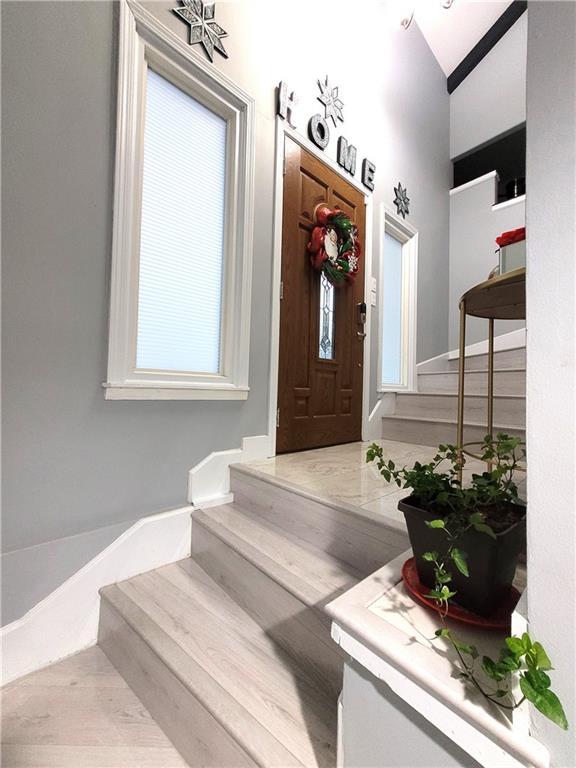 foyer entrance featuring stairway