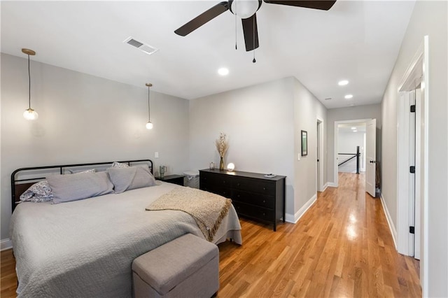 bedroom with visible vents, recessed lighting, light wood-style floors, baseboards, and ceiling fan