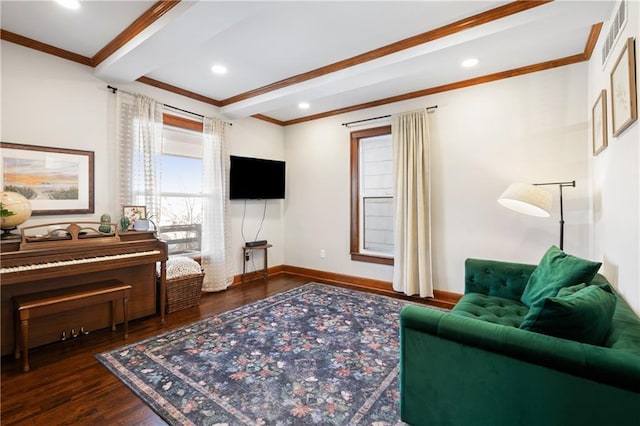 living area featuring wood finished floors, visible vents, baseboards, ornamental molding, and beamed ceiling