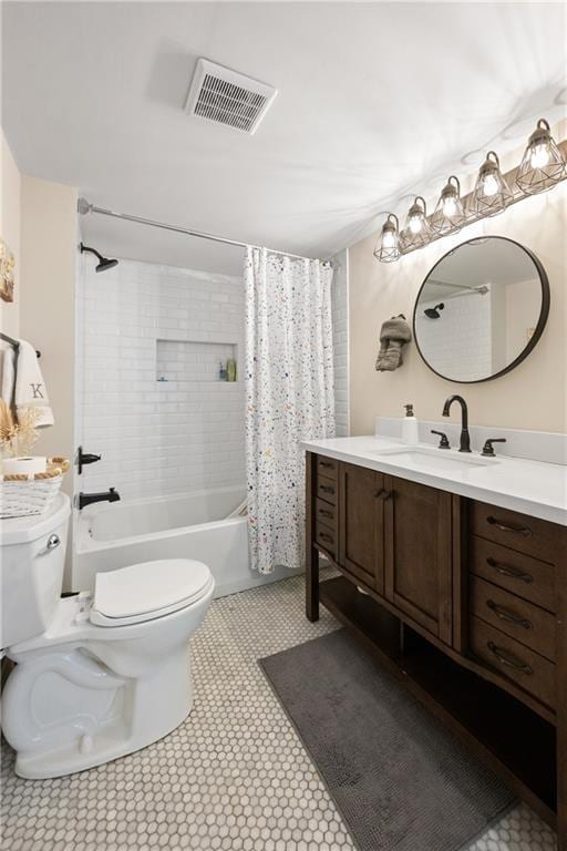 bathroom featuring vanity, toilet, shower / bathtub combination with curtain, and visible vents