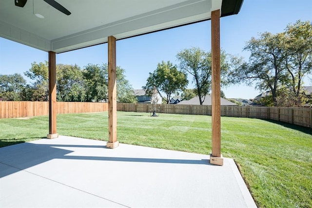 view of patio with a fenced backyard and a ceiling fan