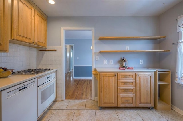 kitchen featuring open shelves, white appliances, and light countertops