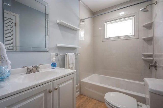 bathroom with  shower combination, wood finished floors, vanity, and toilet