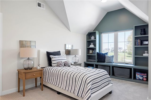 bedroom with lofted ceiling, light carpet, and baseboards