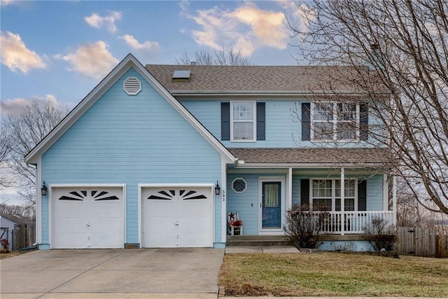 traditional-style home with driveway, a shingled roof, a porch, an attached garage, and a front lawn